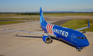 United Airlines' custom 250th anniversary livery on its Boeing 737-800 features a bold red, white, and blue design.