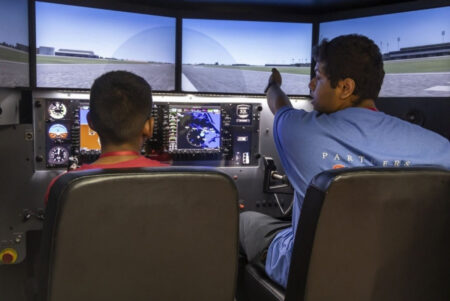 Queens Students Take to the Sky from York College Classrooms Students in the JFK Aviation and Aeronautics Academy at York College train on the college's flight simulators.