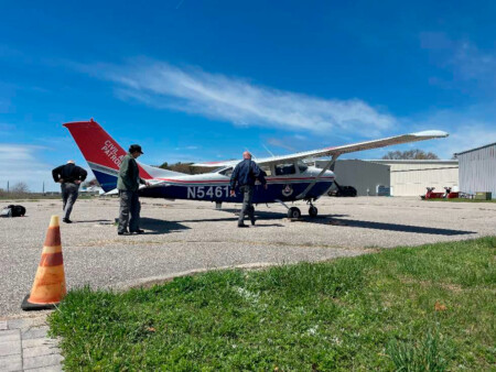 CAP aircrew carrying out preflight checks before a training mission from Long Island MacArthur Airport in a Cessna U206 Stationair.