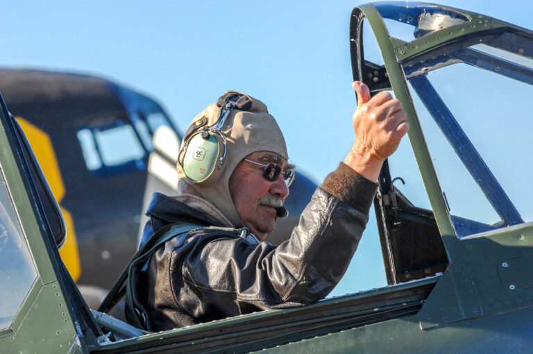 Dan Dameo prepares for flight ops in the cockpit of an American Airpower warbird.