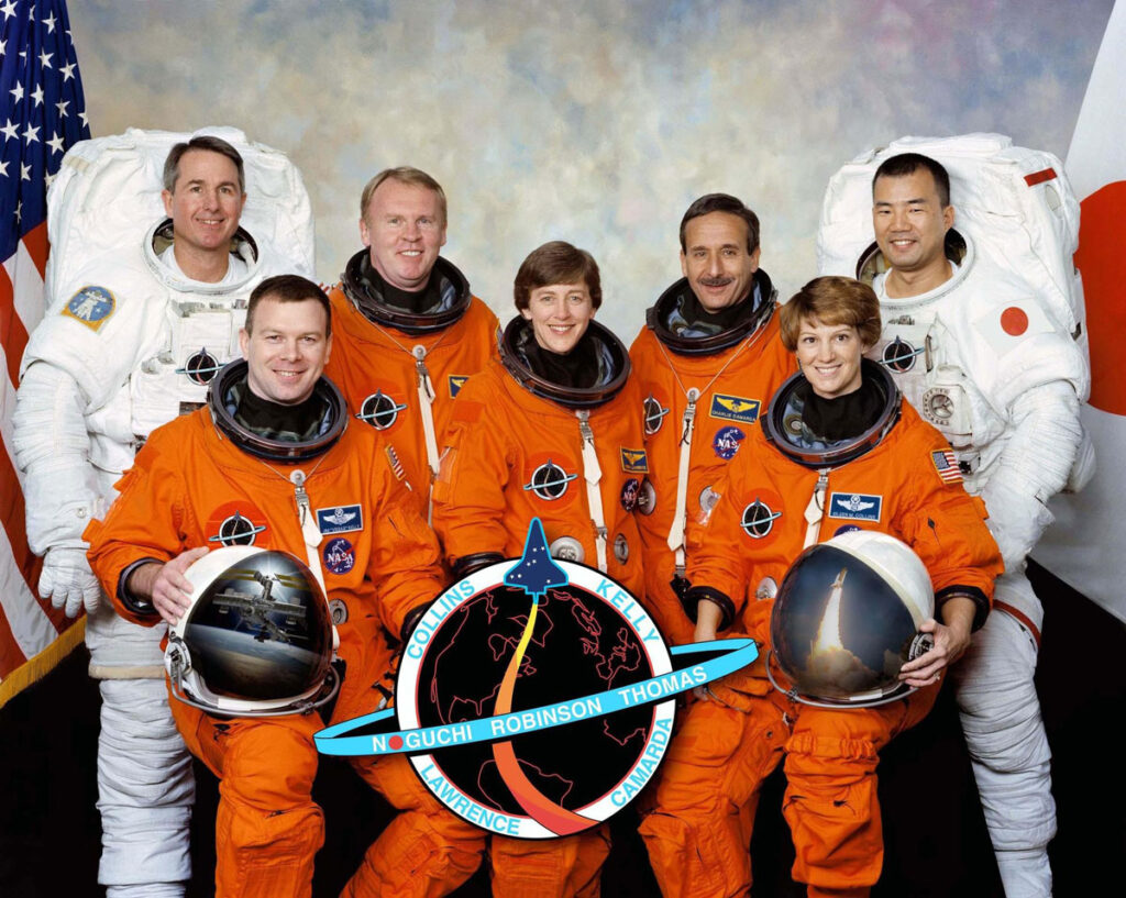 Eileen Collins, seated (R) & Discovery STS-114 crew.