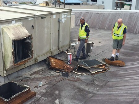 FEATURE PUERTO RICO12 HURRICANE PA EMPLOYEES SURVEYING ROOFTOP DAMAGE AT SAN JUAN AIRPORT Metropolitan Airport News