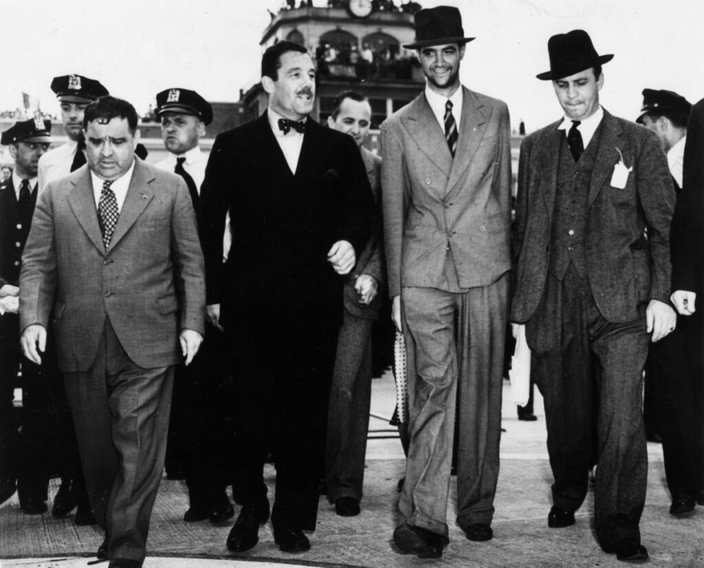 Fiorello La Guardia New York Airport Floyd Bennett Field Howard Hughes (2nd from R) with Mayor La Guardia, Grover Whalen after Hughes return from round the world flight 1938. (Cradle of Aviation Museum)