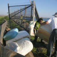 Port Authority Responds Quickly to Dumping Issues On LaGuardia Shoreline New York Airport Hauling Blocks into Loader Metropolitan Airport News