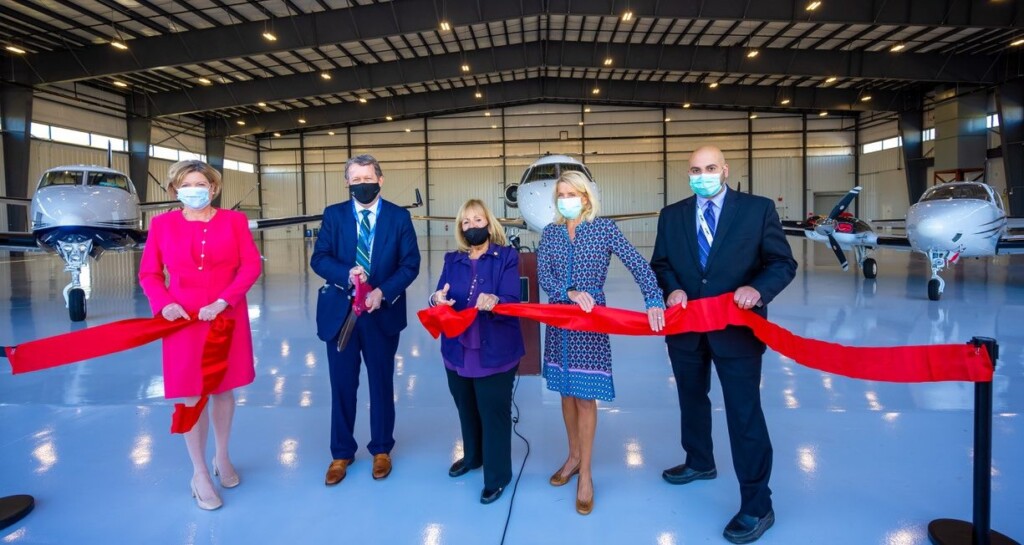 Town of Islip officials join Hawthorne Global Aviation executives to cut the ribbon on the companys new hangar.