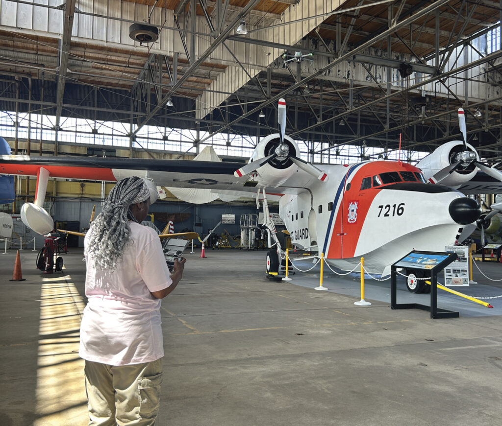 Beverly Holder flying a drone inside Hangar B 
at Floyd Bennett field.
