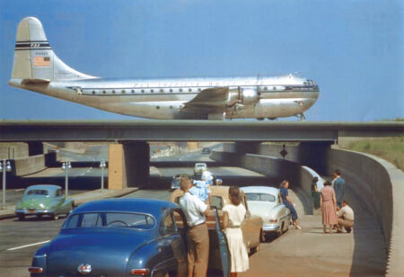 An Aviation Chronicle Idewild-Kennedy Pan-American Boeing 377-Stratocruiser taxiis on Idlewild Van-Wyck Expressway overpass-c.1951. (National Archives)
