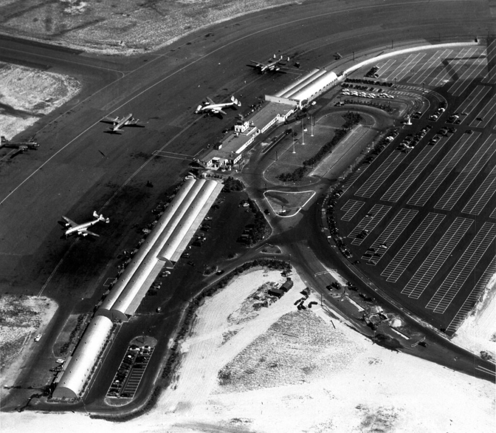 Hope for the Best, Prepared for the Worst New York Airport Idlewild-Kennedy Aerial view of temporary terminal buildings and parking areas. Three Lockheed Constellations are parked at terminals. Taxiing is a Douglas DC-4. (Cradle of Aviation Digital Archives-1948)