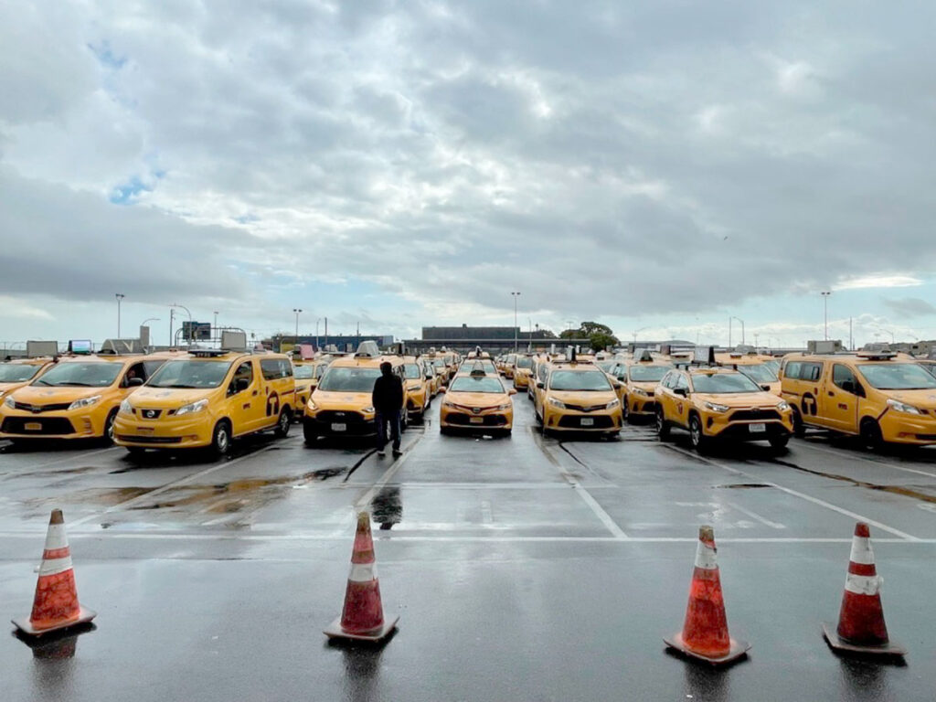 Cabs lined up at JFK's central taxi hold lot.