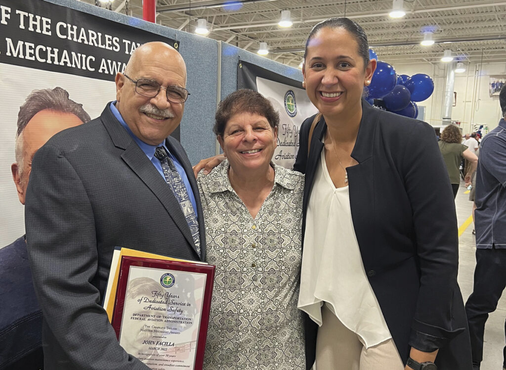 The Charles Taylor Master Mechanic Award New York Airport John Facilla with his wife, Josephine, and Evita Garces.