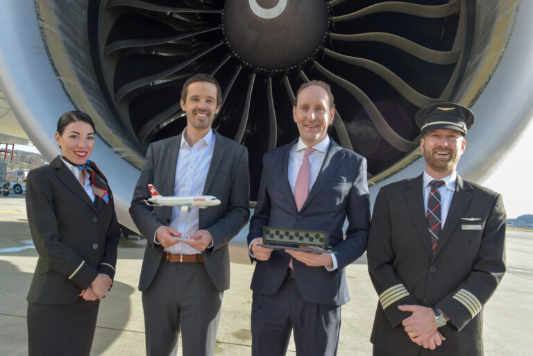 Jan Wurzbacher, co-founder and co-CEO of Climeworks, and SWISS CEO Dieter Vranckx, flanked by a SWISS crew at Zurich Airport in February 2024.