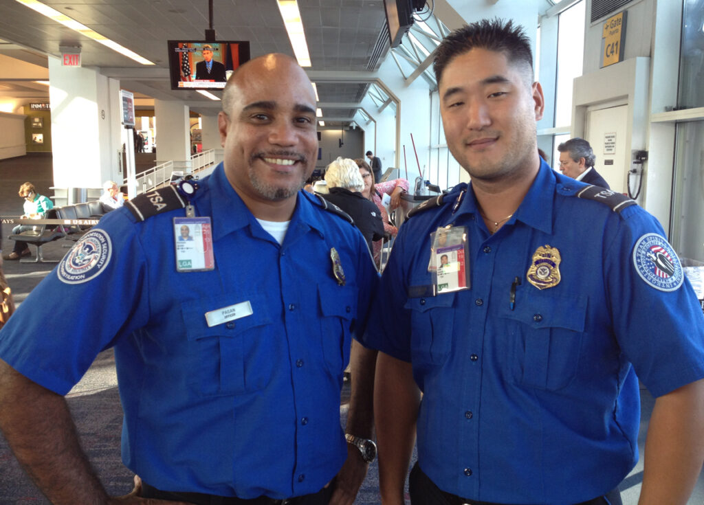 LaGuardia Airport TSA officers Jose Pagan and Inhwan Kim.