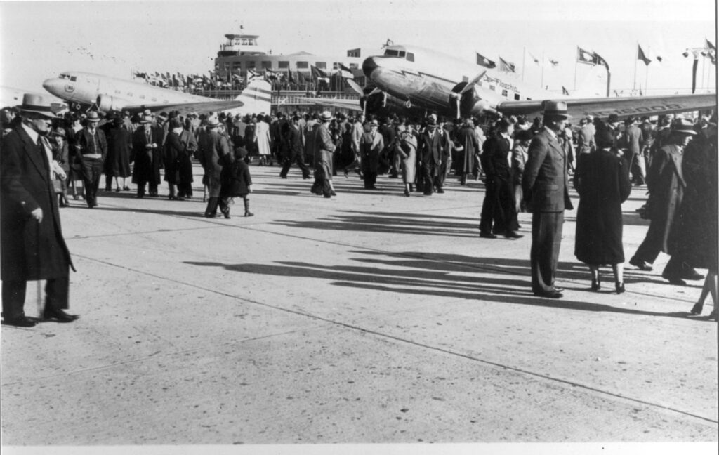 Fiorello La Guardia New York Airport LaGuardia Crowds at airport ramp area with two Douglas DC-3s during the dedication of New York Municipal Airport, October 15, 1939. (Cradle of Aviation Museum)