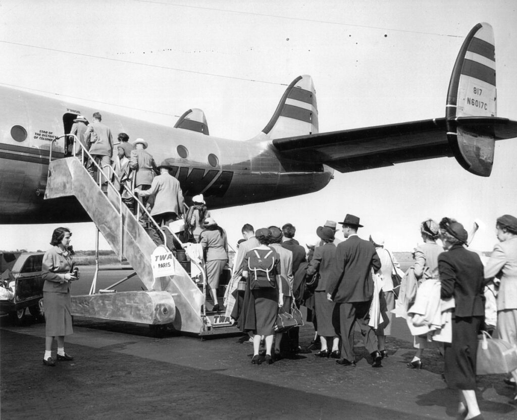 LaGuardia Passengers Boarding TWA Constellation departing for Paris. Carried 62 on Trans Atlantic crossings. Flight crew of 5 plus several stewardesses c.1947 8.28.170 1 Metropolitan Airport News