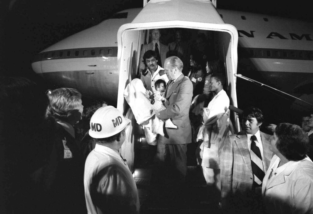 President Gerald R. Ford Carrying a Vietnamese Baby from "Clipper 1742"