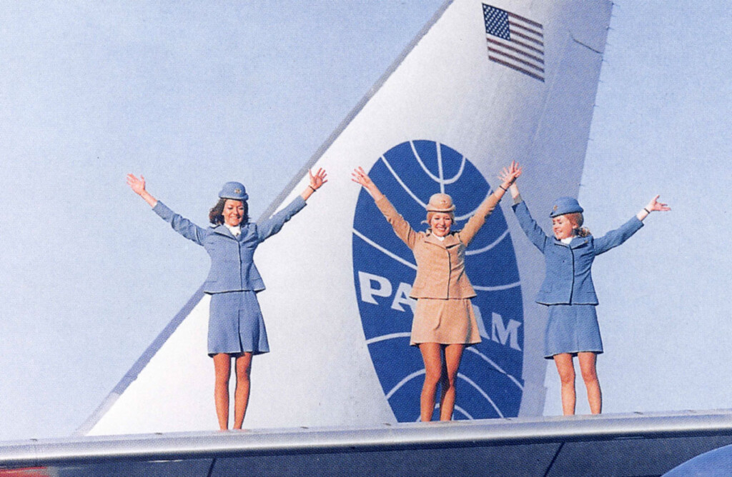 On the Runway - Flying In Fashion New York Airport Pan Am promotional-photo of stewardesses-standing on wing of a Boeing 747.