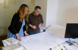 Cheryl McKissack Daniel reviewing blueprints.