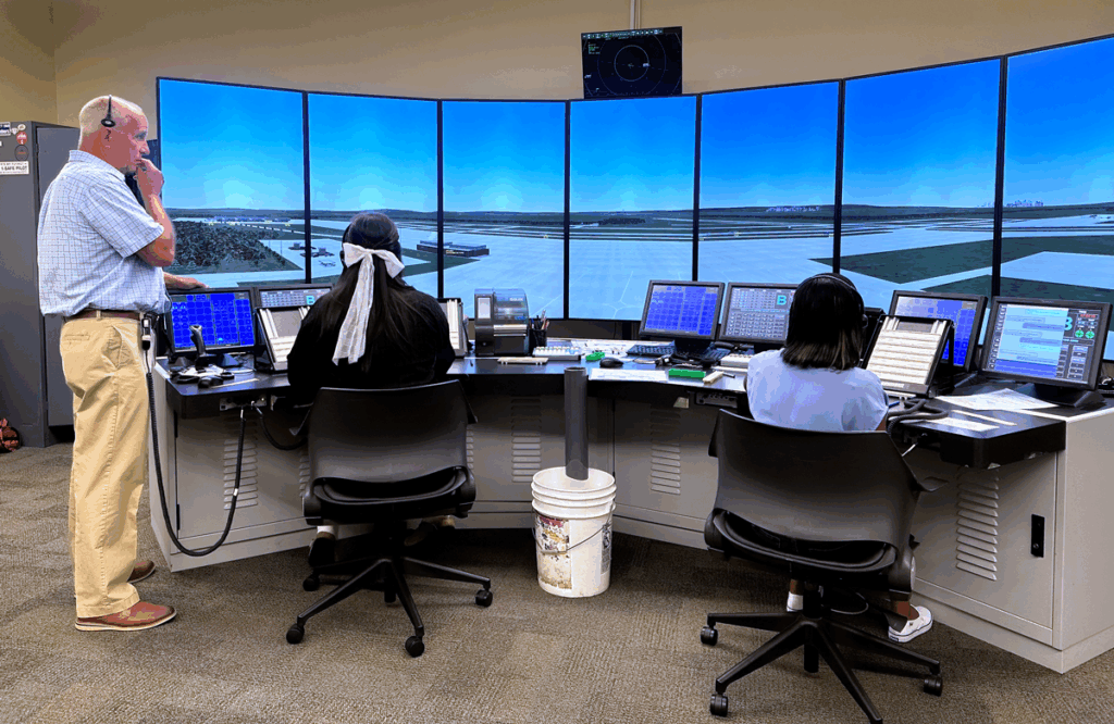 Steven Fanno, Vaughn Instructor and Former Air Traffic Controller, with Students in ATC Lab.