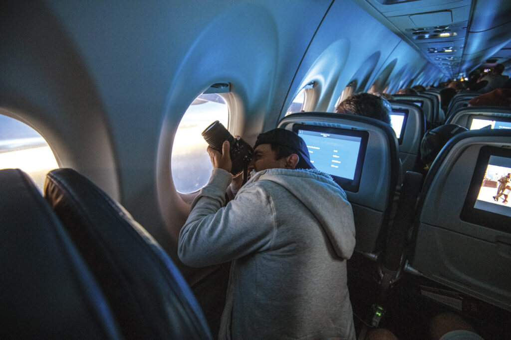 Delta Air Line passengers photograph the eclipse during an eclipse flight from AUS to DTW.