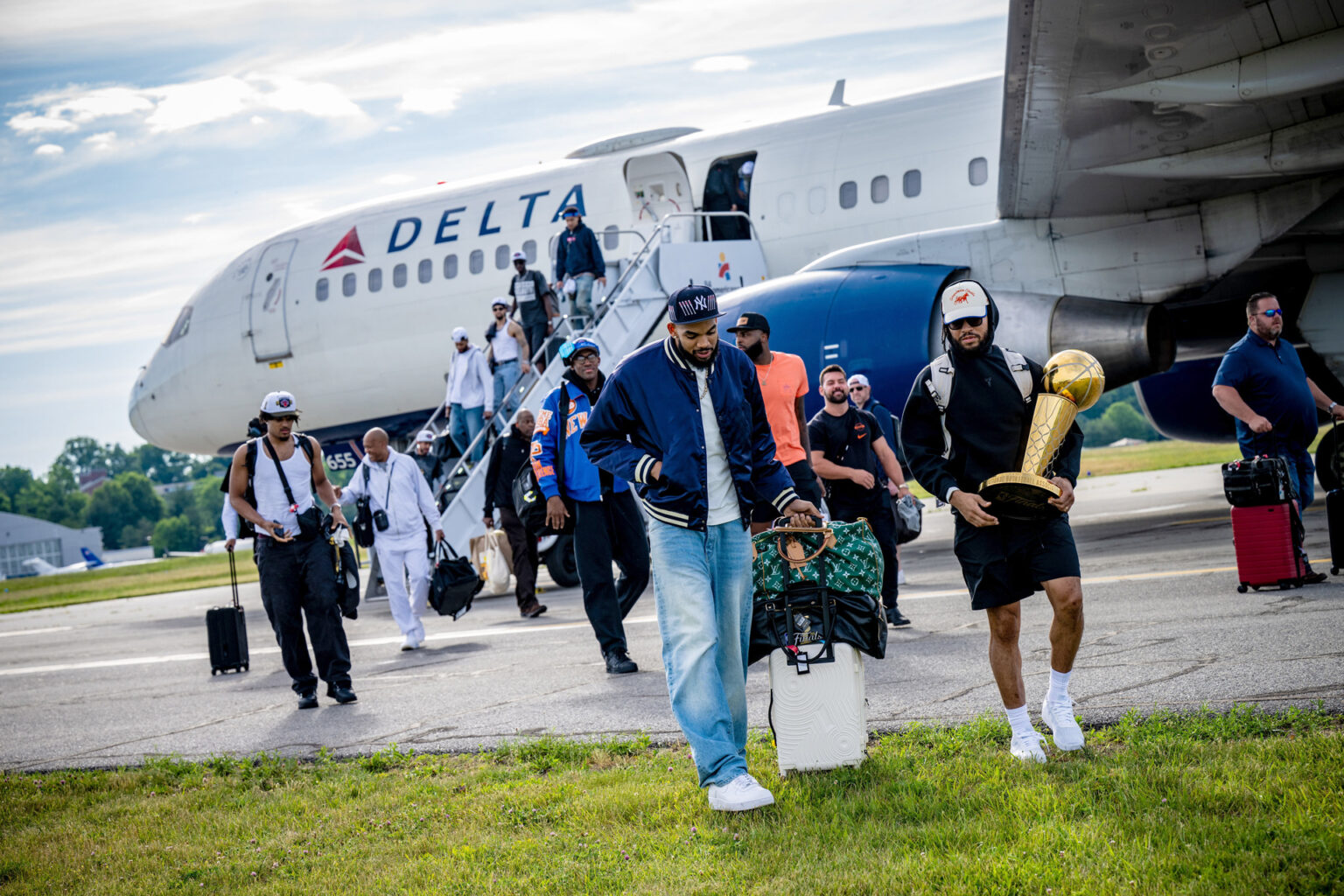 The championship-winning New York Knicks arrive at Westchester County Airport on Sunday morning following their epic Game 5 victory.