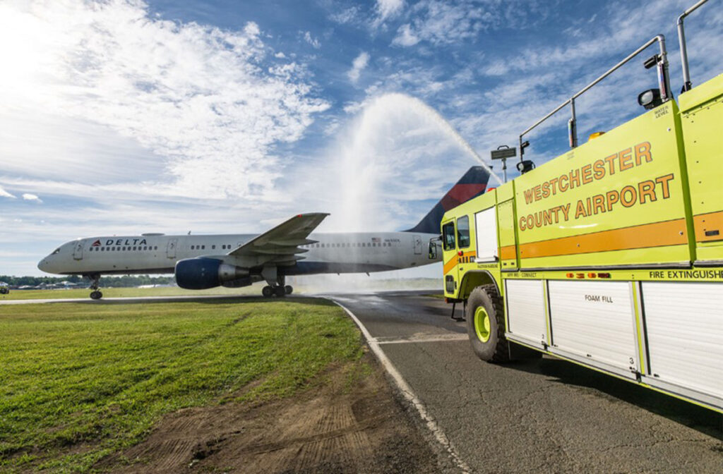 Delta Celebrates Knicks' Game 5 Victory with Homecoming Flight New York Airport HPN Airport fire trucks give the New York Knicks a well-deserved water cannon salute as they arrive home with the trophy.
